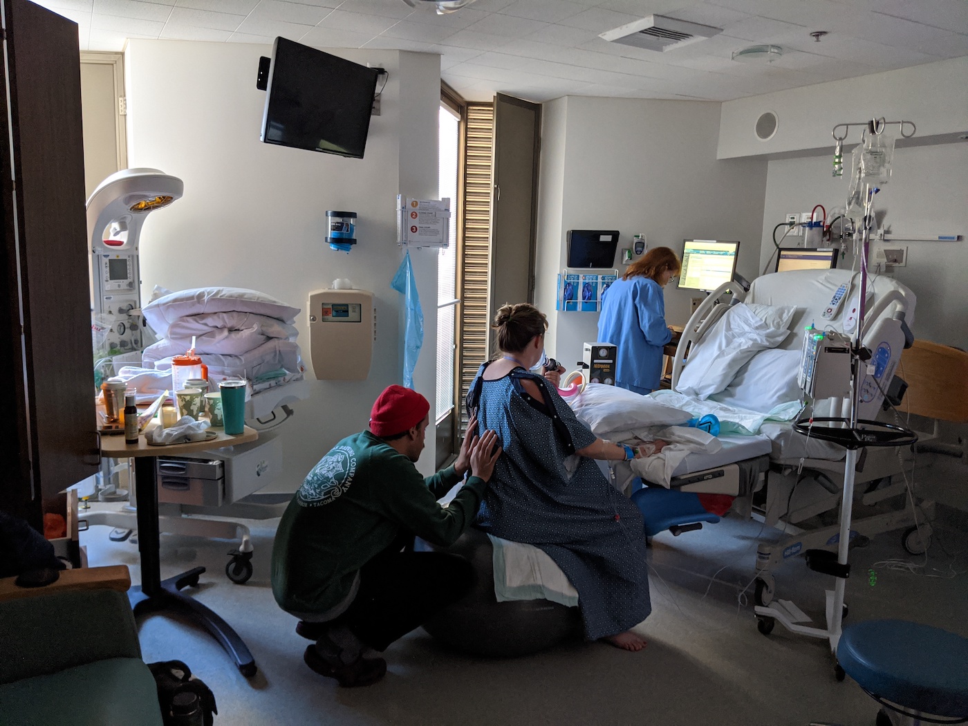 Partner supporting birthing person during labor